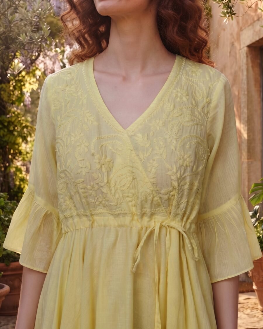 Woman wearing Elara Butter Yellow Cotton Flared Midi Dress by Jivaraa